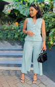 Sky-blue sleeveless vest and wide-leg trousers with buttoned V-neck detail