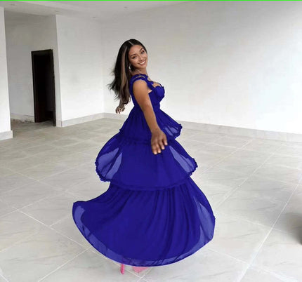 Blue sleeveless tiered ruffle maxi dress with sweetheart neckline and ruffled sleeves, side view
