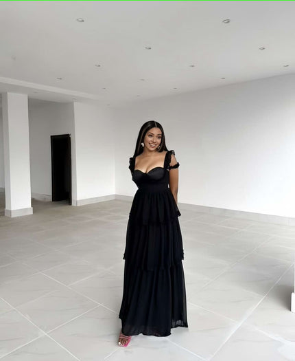 Black sleeveless tiered ruffle maxi dress with sweetheart neckline and ruffled shoulders