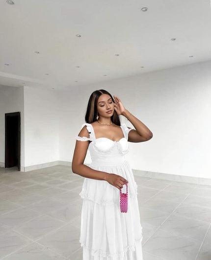 White sleeveless tiered ruffle maxi dress with sweetheart neckline and off-shoulder ruffles
