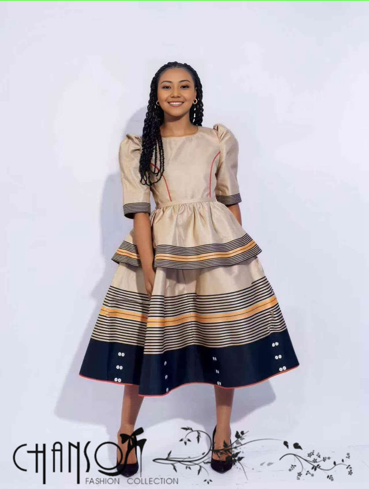 Beige midi dress with puff sleeves, striped tiered skirt in navy and orange accents
