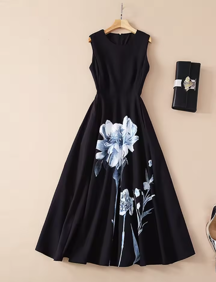 Black sleeveless formal dress with large blue floral print at hem