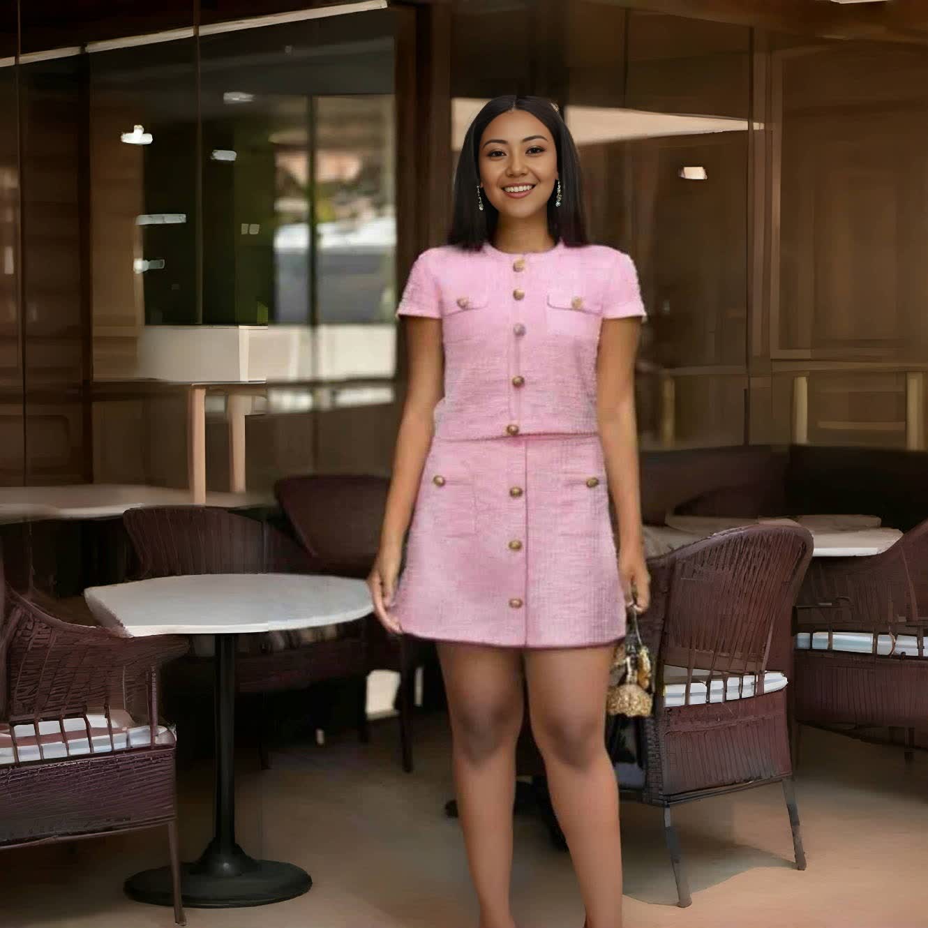 Pink button-front short-sleeve jacket and matching mini skirt suit, gold buttons