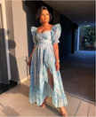Light blue sweetheart maxi dress with puff sleeves, fitted bodice and front slit