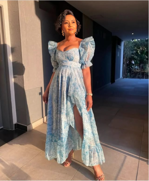 Light blue sweetheart maxi dress with puff sleeves, fitted bodice and front slit
