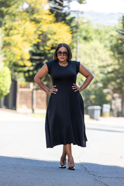 Black A-line midi dress, sleeveless with fitted bodice and flared mid-calf skirt
