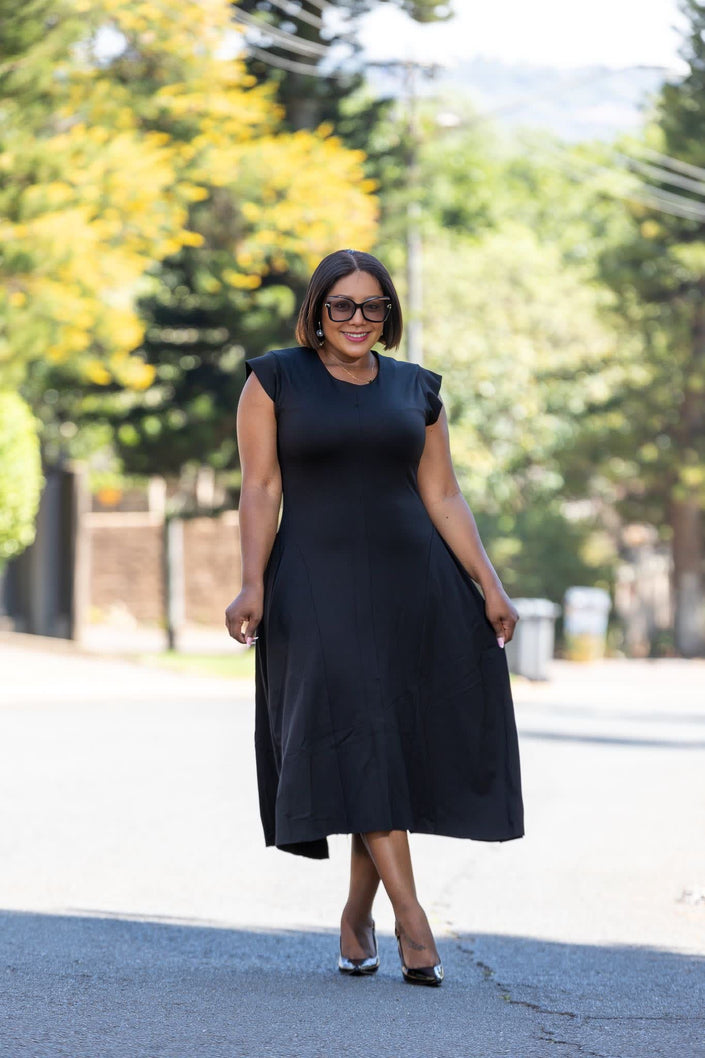 Black A-line midi dress, sleeveless with round neckline and flared skirt