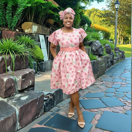 Pink rose print midi dress with puff sleeves and belt at the waist