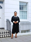 Black midi dress with contrast collar, long sleeves, and center-button detail