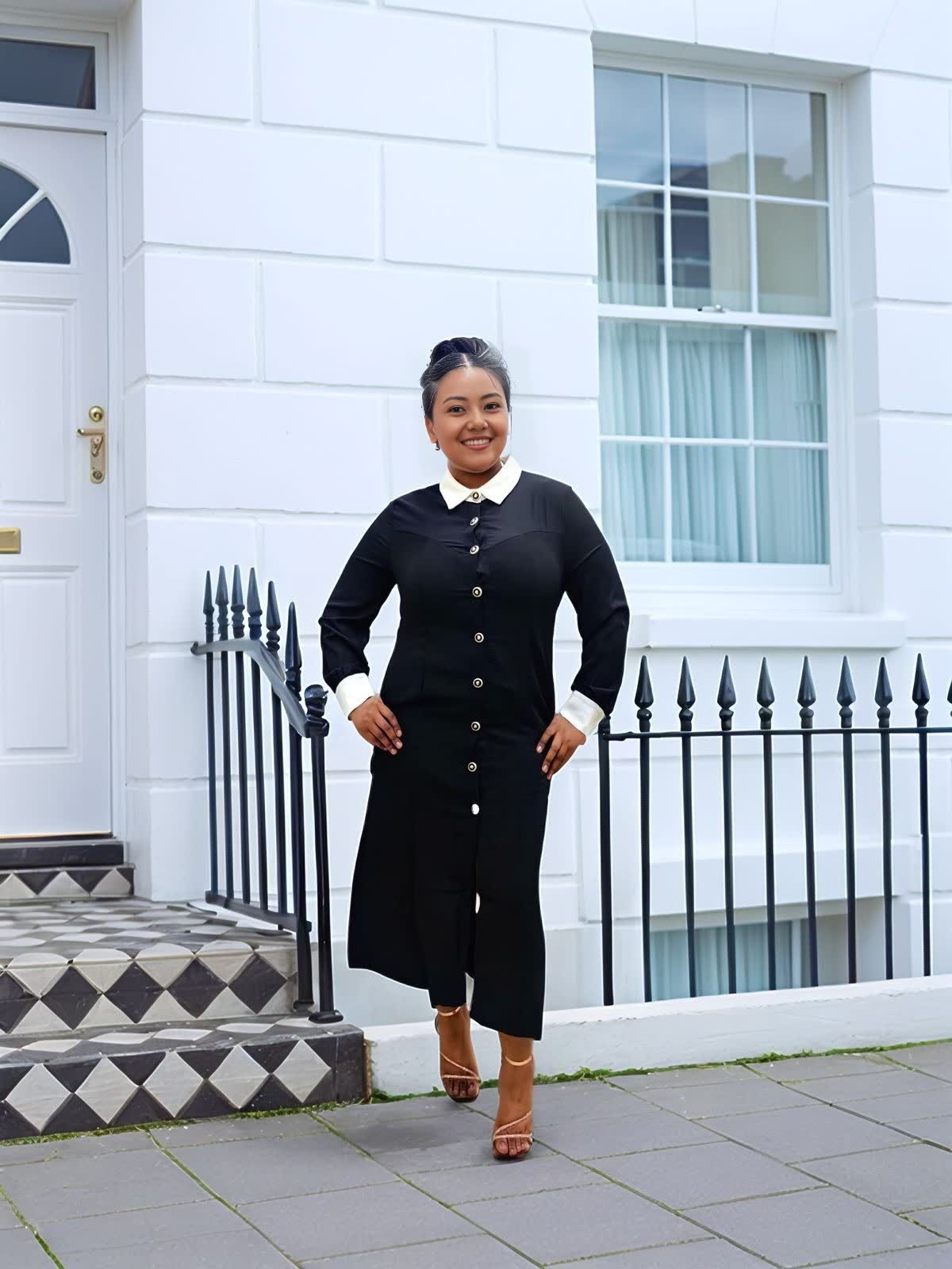Black midi shirt dress style with contrast white collar and long sleeves