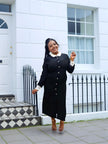 Black vintage midi dress featuring contrast white collar and buttoned placket