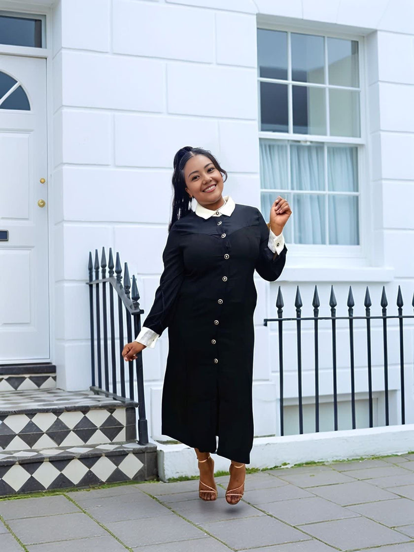 Black vintage midi dress featuring contrast white collar and buttoned placket