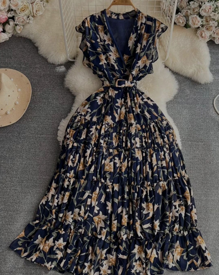 Navy-blue floral midi dress with tied waist and tiered skirt