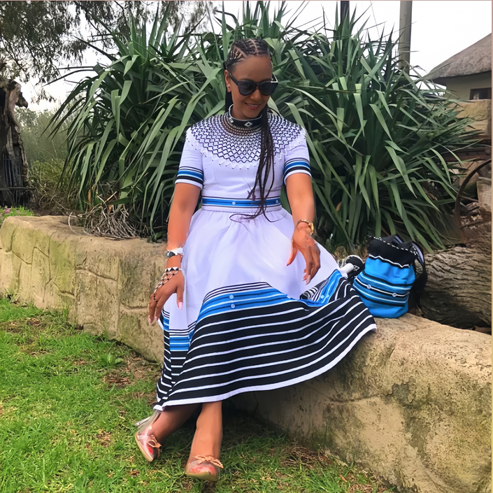 Cinched-waist midi dress with striped hem, white with blue stripes on sleeves and bottom