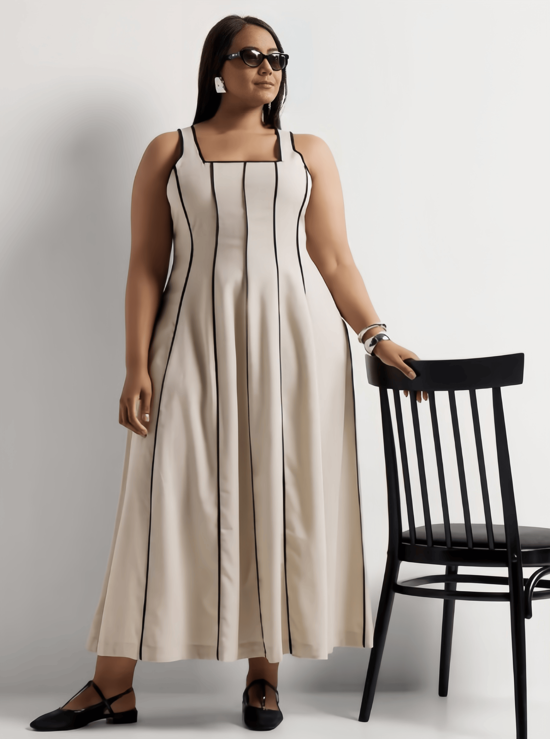 Cream striped sleeveless maxi dress with square neckline, gathered skirt pleats