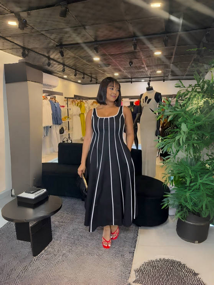 Black striped sleeveless maxi dress with square neckline, flared gathered skirt