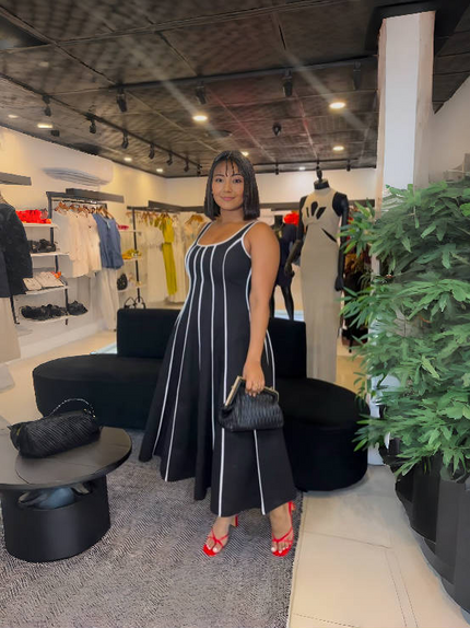 Navy striped sleeveless maxi dress with square neckline, flowing gathered skirt