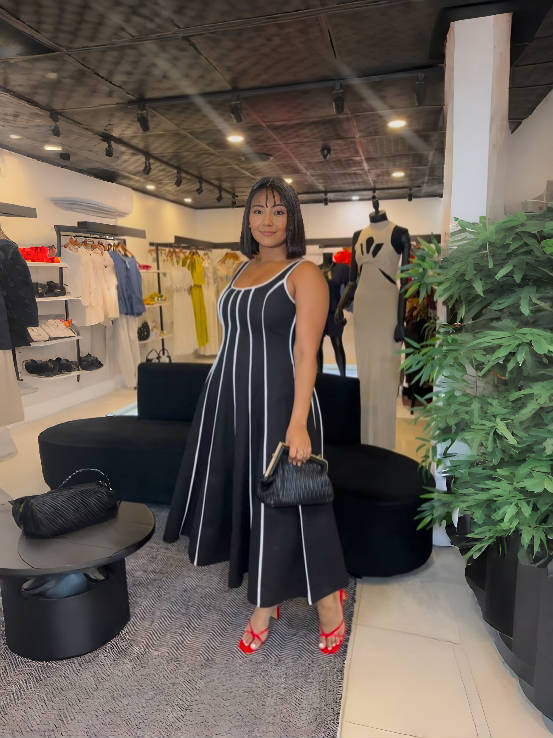 Navy striped sleeveless maxi dress with square neckline, flowing gathered skirt