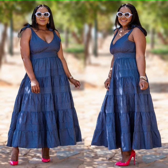Blue denim maxi dress with tiered skirt and adjustable bow straps