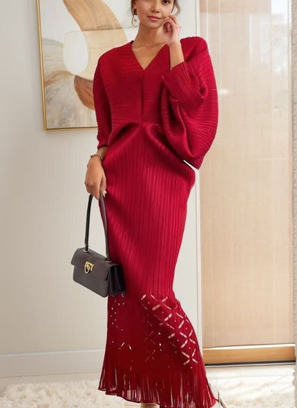 Red knit maxi dress, loose fit with V-neck and long sleeves, tassel hem detail