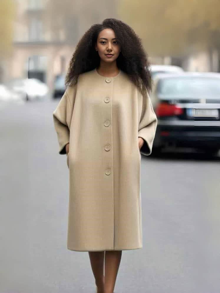 Tan oversized long coat with button front, round neckline, and wide sleeves