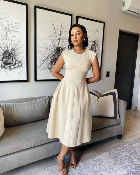 Beige A-line midi dress, sleeveless with round neckline and gathered flared skirt