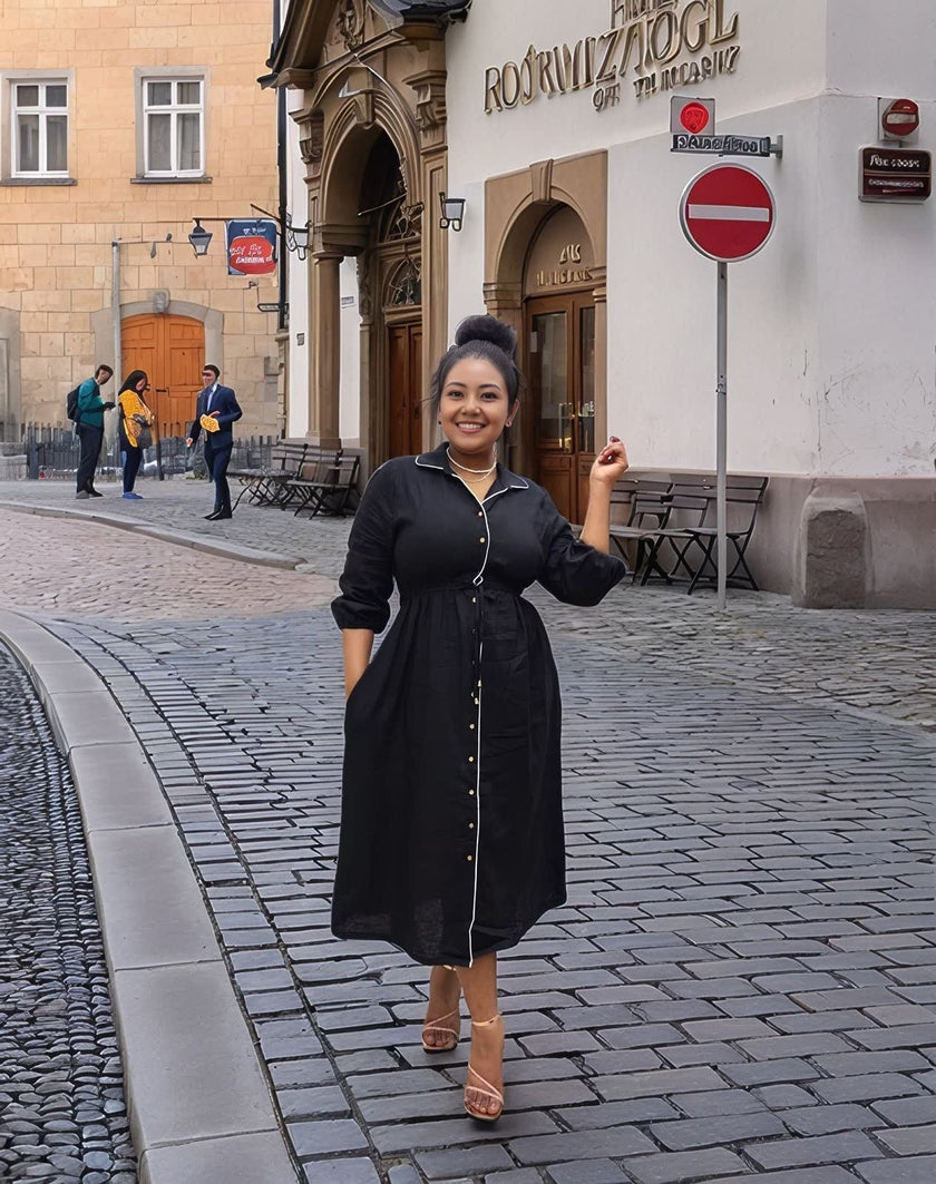 Black midi button-front dress with waist tie detail, long sleeves and V-neck