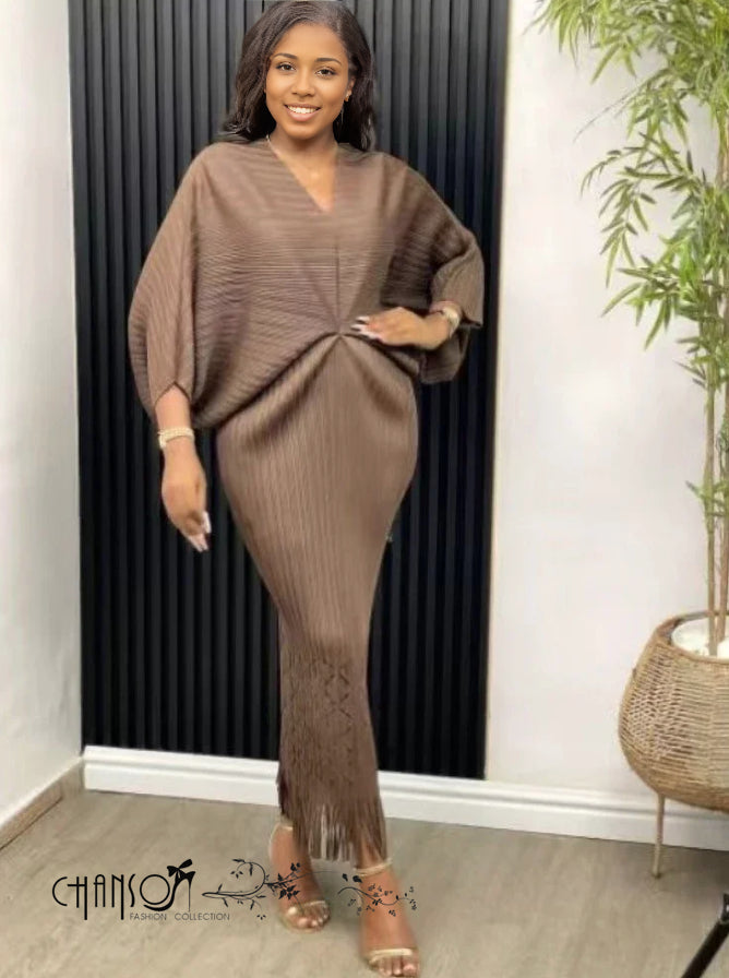 Coffee brown knit maxi dress with V-neck, loose fit, ribbed texture, tassel hem