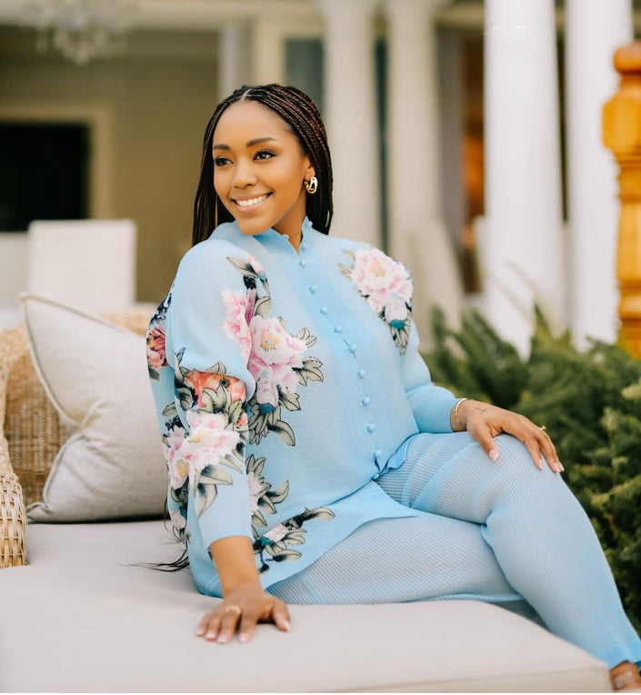Light blue twin set with floral embroidered top and matching loose pants.