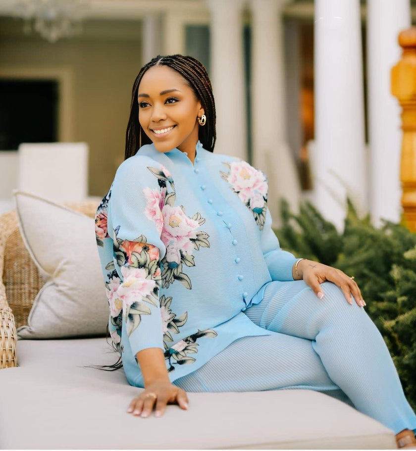 Light blue twin set with floral embroidered top and matching loose pants.