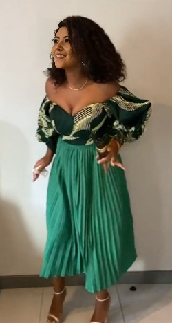 Teal off-shoulder pleated skirt outfit with patterned ruffle sleeves