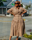 Tan midi dress with button-up front and gathered waist, long sleeve ruffle hem