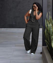 Black wide-leg jumpsuit with sleeveless V-neck vest and button front