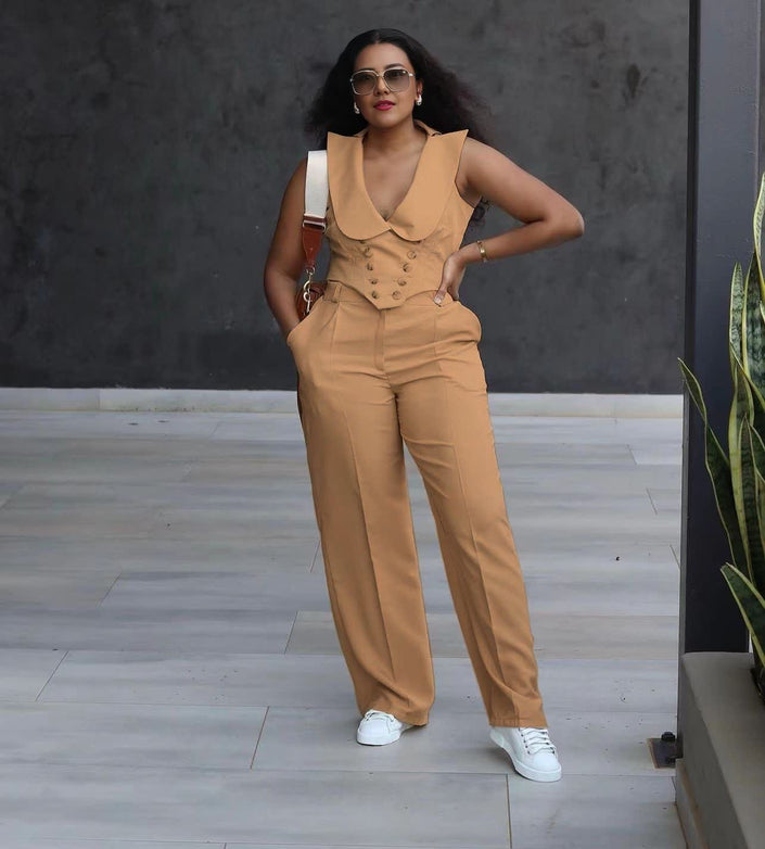 Tan wide-leg jumpsuit with V-neck sleeveless vest, double-breasted buttons, and long pants