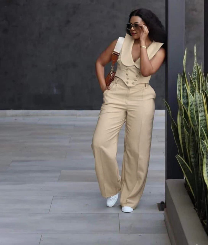 Beige wide-leg jumpsuit with sleeveless layered collar vest and buttoned bodice