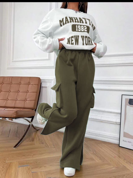 White cropped sweatshirt with brown 'Manhattan 1982 New York' graphic on back