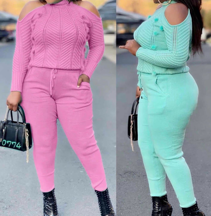 Off-shoulder knit twin set with high-waist pants in pink and aquamarine, cable knit