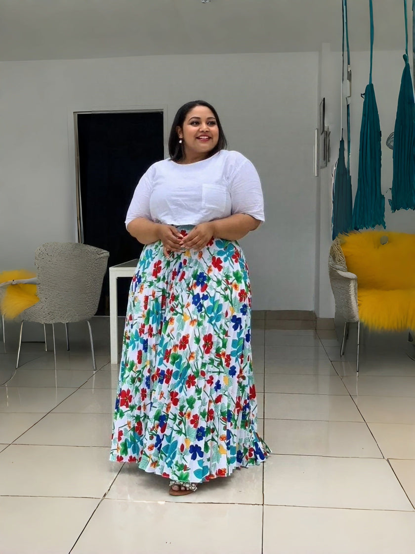 Women’s floral maxi skirt with elastic waist and matching white short-sleeve top.