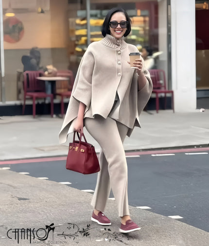Beige knitted high-neck cape twin set with buttoned front and draped top