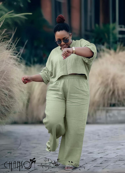 Green relaxed-fit blouse and wide-leg pants set with elastic waist and cuffed sleeves