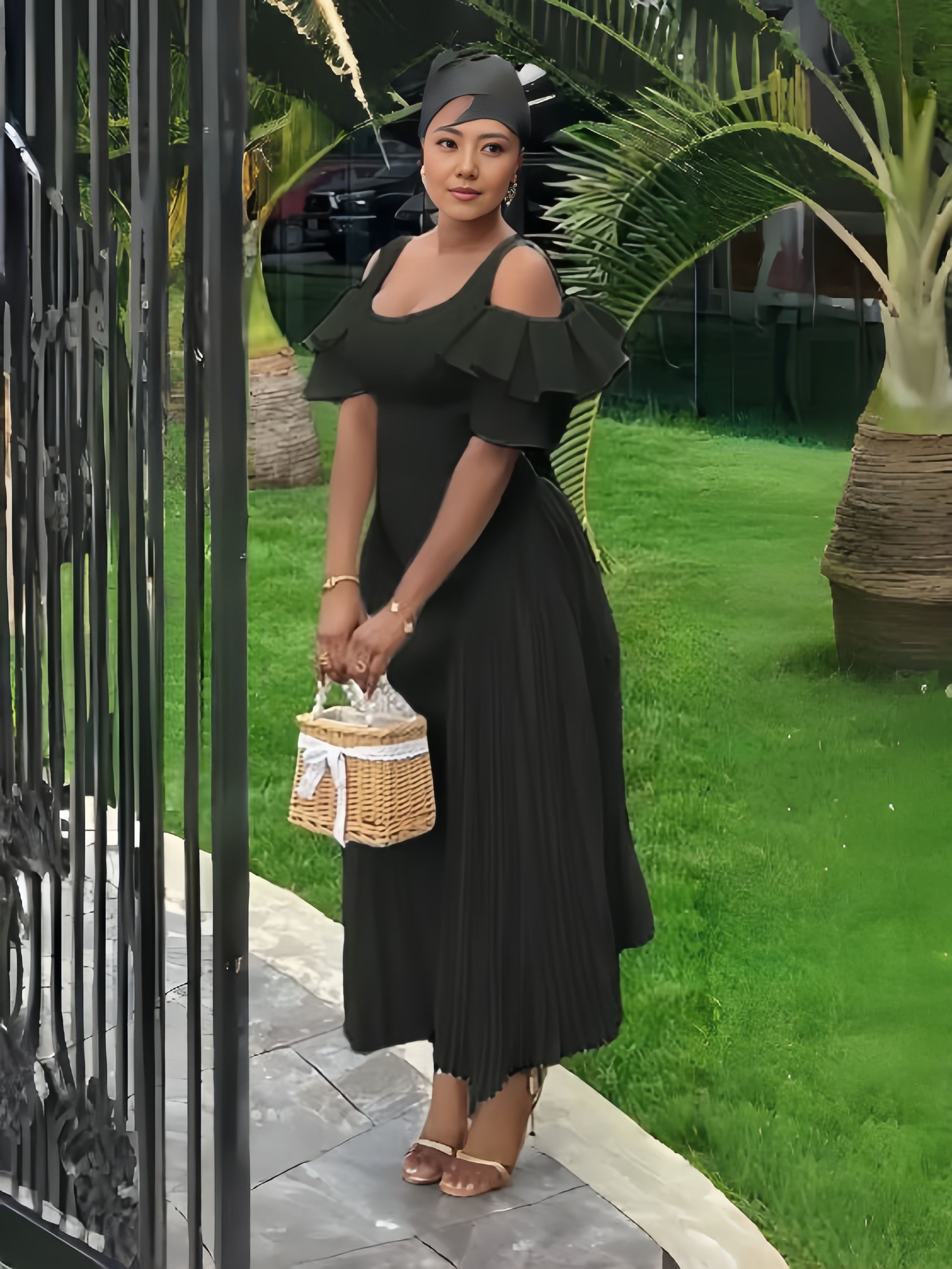 Off-shoulder maxi dress in black with ruffle sleeves and pleated skirt