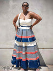 Tiered maxi dress with cream bandeau and blue striped skirt with red accents