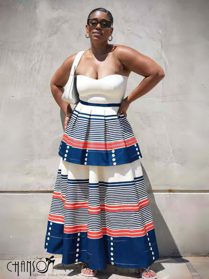 Tiered maxi dress with cream bandeau and blue striped skirt with red accents