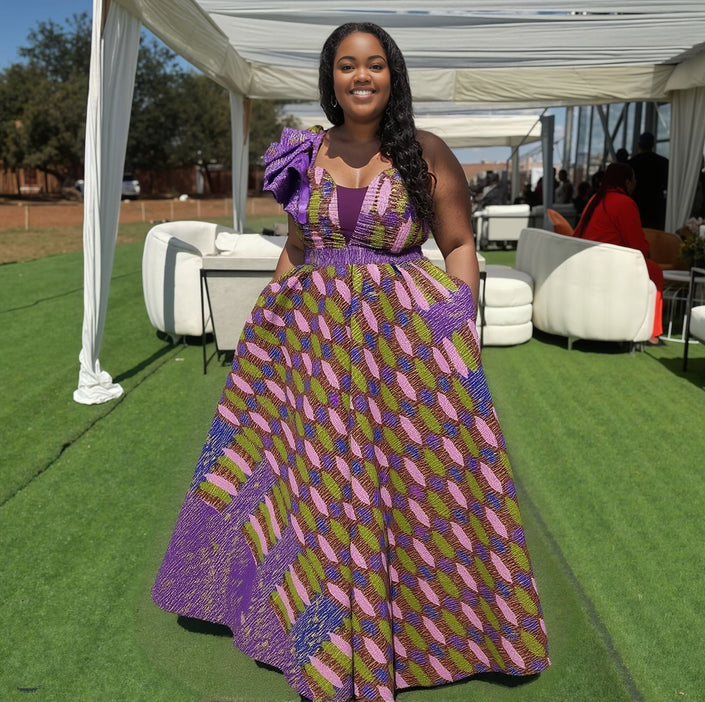 One-shoulder maxi dress with bow detail, purple multicolor striped skirt