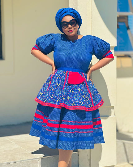 Blue puff-sleeve twin set dress with fitted bodice and flared patterned skirt