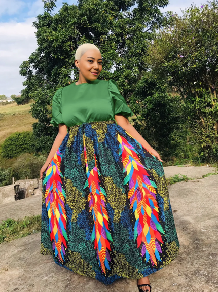 Maxi skirt set: green puff-sleeve top and multicolor feather-print maxi skirt