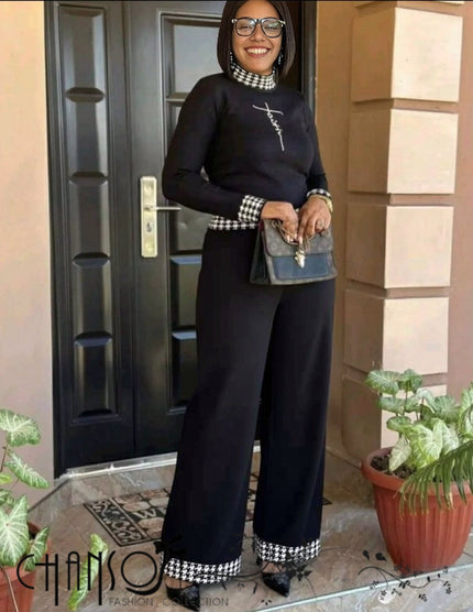 Black knit twin set with houndstooth trim, long sleeves and matching wide-leg pants