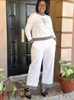 White knit twin set with houndstooth trim, long sleeves and matching wide-leg pants