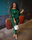 Dark green lounge set with long-sleeve top and fitted joggers, lace-like side trim