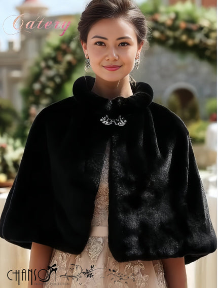 Black faux fur capelet with rounded collar and jeweled brooch front